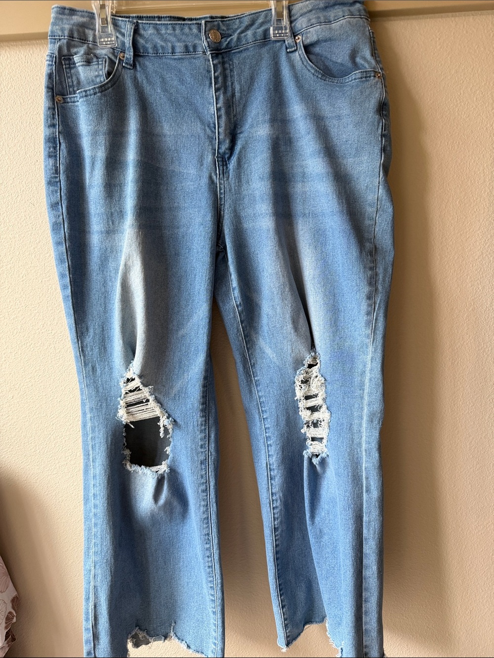 Light blue destroyed jeans